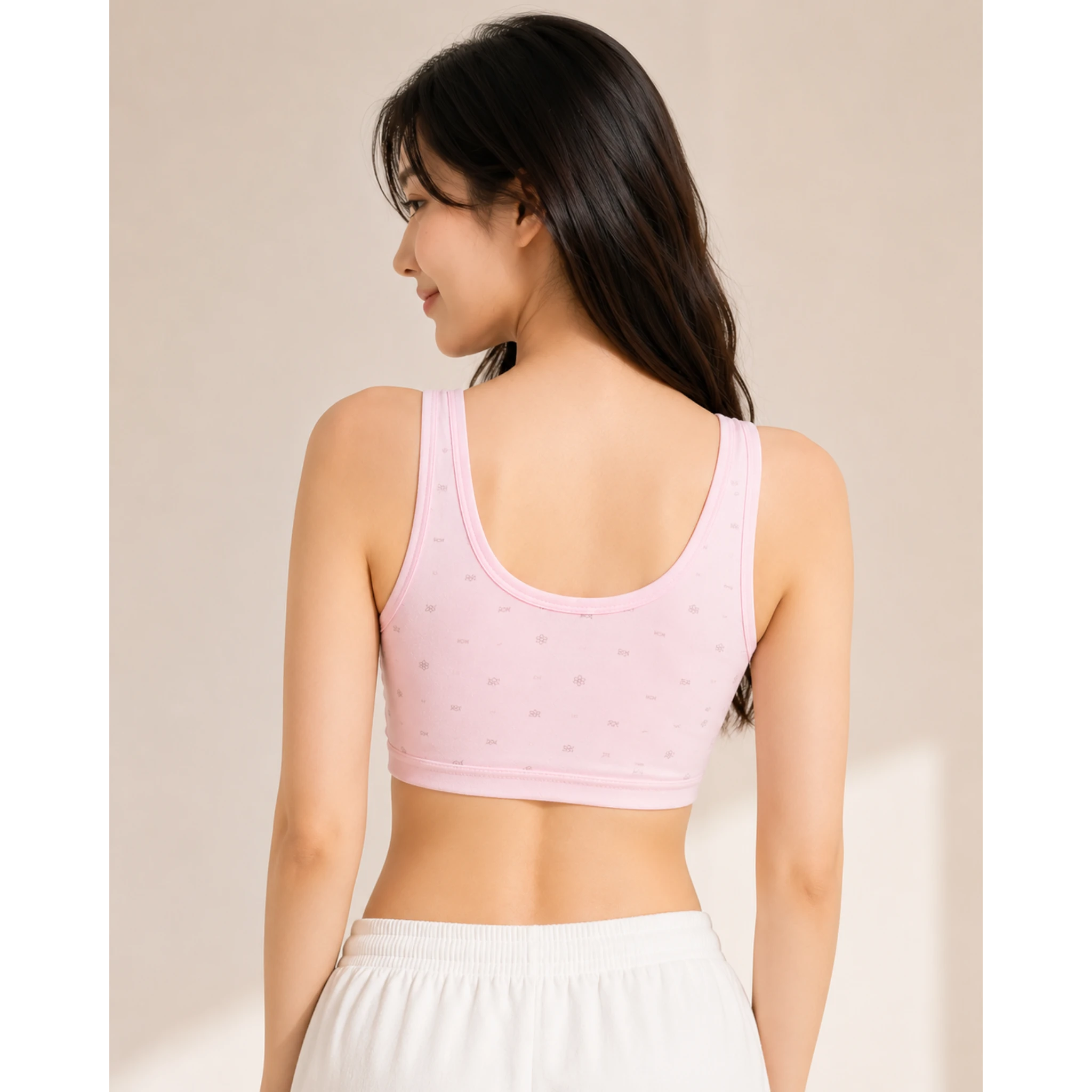 Back view of teen girl wearing soft pink cotton training bra with scoop back – The Lingerie Store