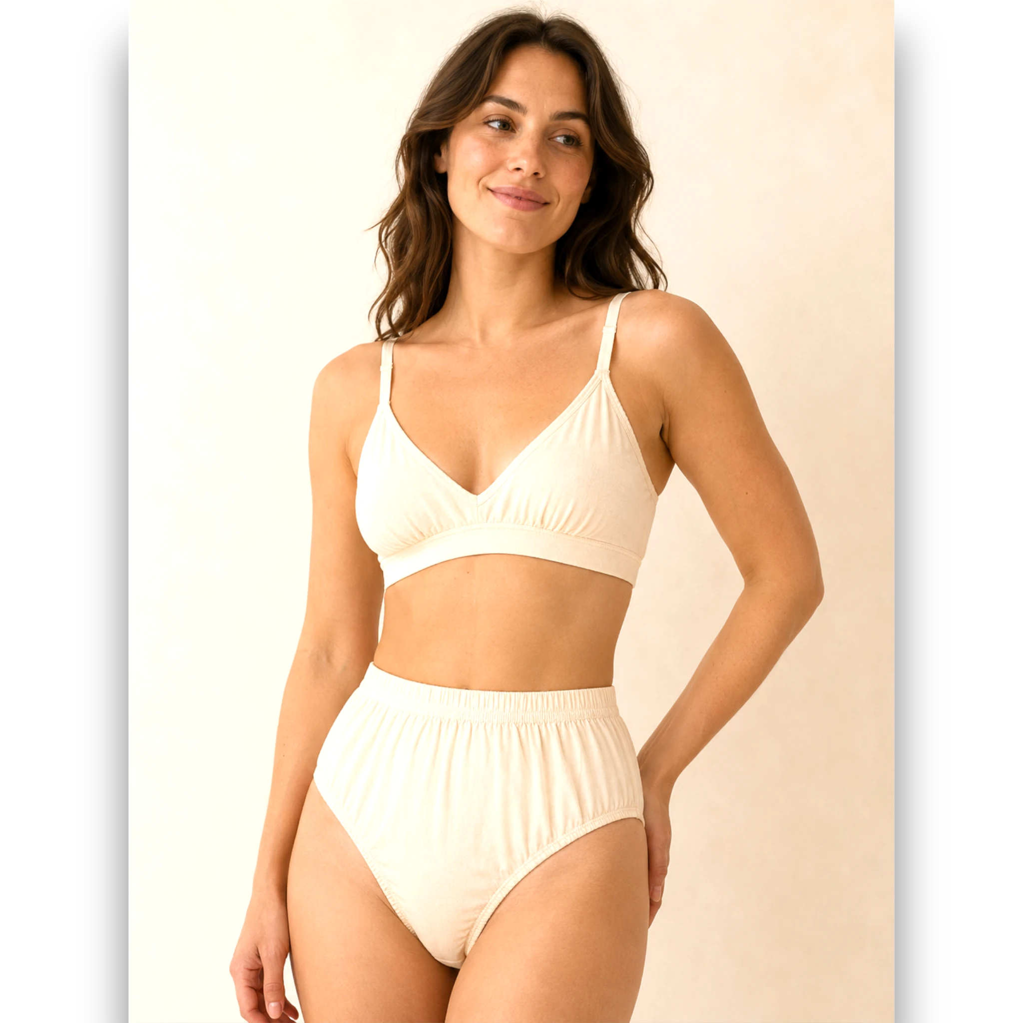 Woman wearing ivory high-waist cotton brief panty, front view in bedroom – The Lingerie Store